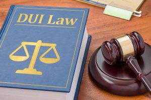 A DUI law book with a gavel next to it.