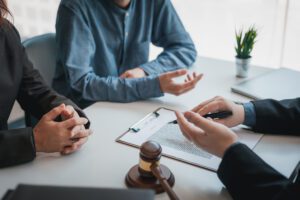 people accused with identity theft talking to a lawyer